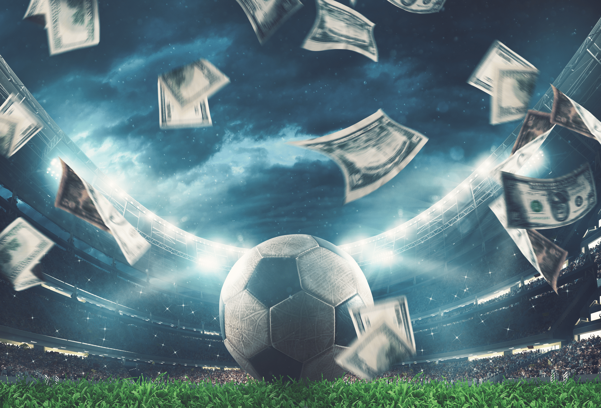 Geld wird um einen Fußball herumgewirbelt. © alphaspirit - stock.adobe.com